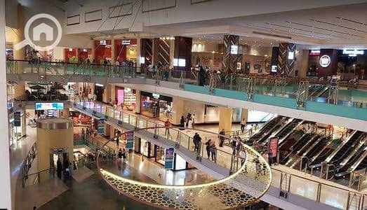 Retail for Sale in 6th of October, Giza - محل لقطه للبيع في اكتوبر 34م دور اول فود كورت بمقدم 410الف بالتقسيط