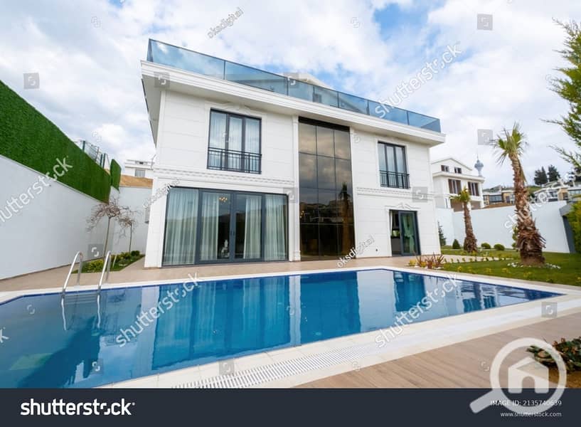 stock-photo-pool-and-exterior-of-duplex-villa-2135740639. jpg