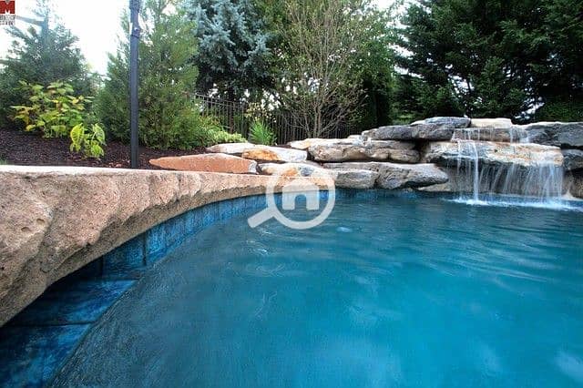 6 mountain-lake-style-inground-salt-water-pool-with-waterfall-monogram-custom-pools-610282-0235-img~e8f13b3506cca7c2_4-4504-1-9f9b5a1. jpg